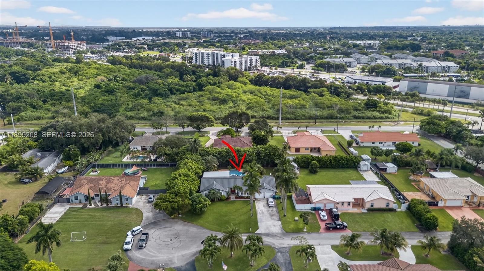 28241 Southwest 157th Court Homestead, FL 33033 - Photo 49 of 52 an aerial view of residential houses with outdoor space and river