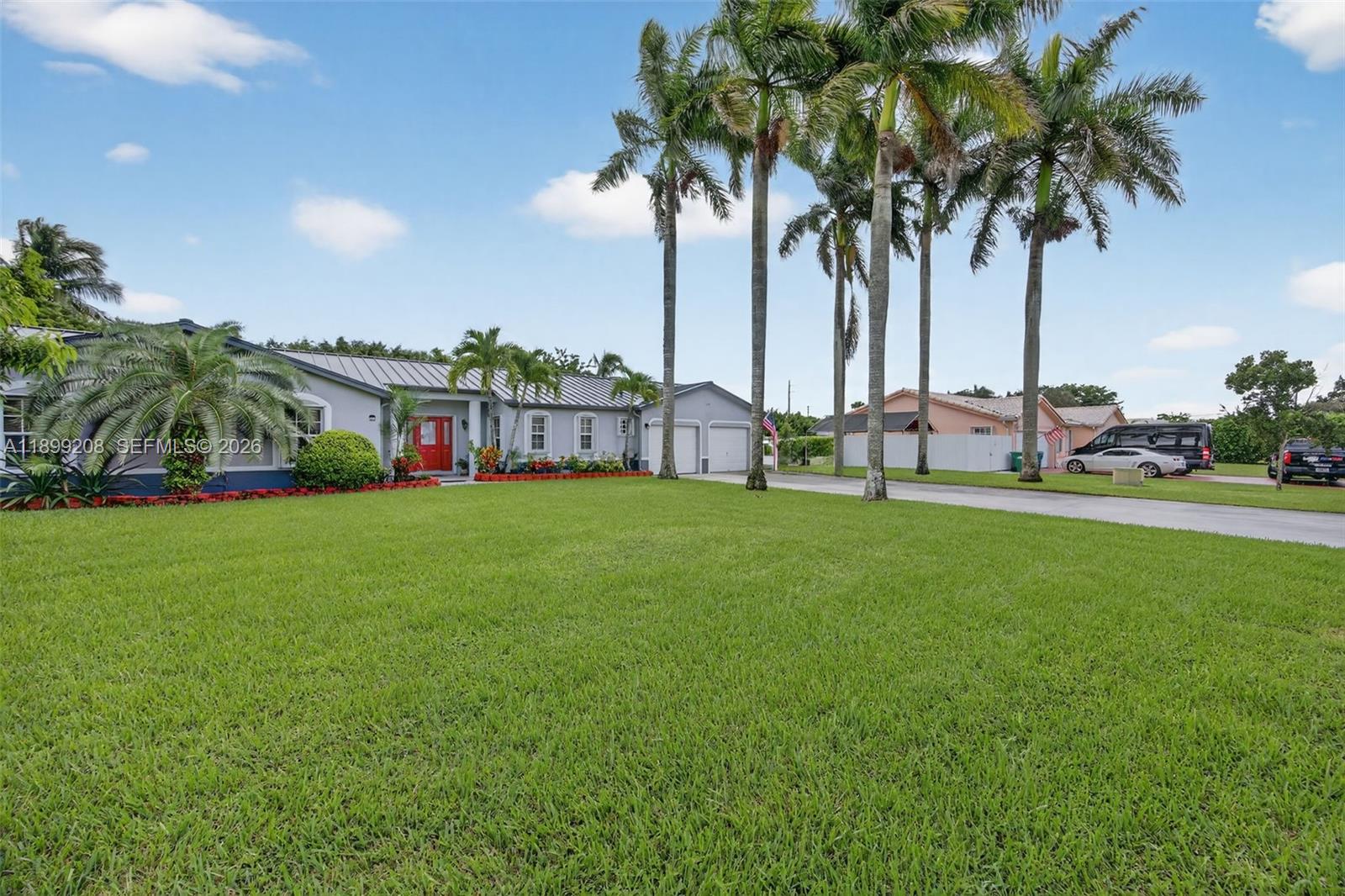 28241 Southwest 157th Court Homestead, FL 33033 - Photo 5 of 52 a view of house with backyard and swimming pool