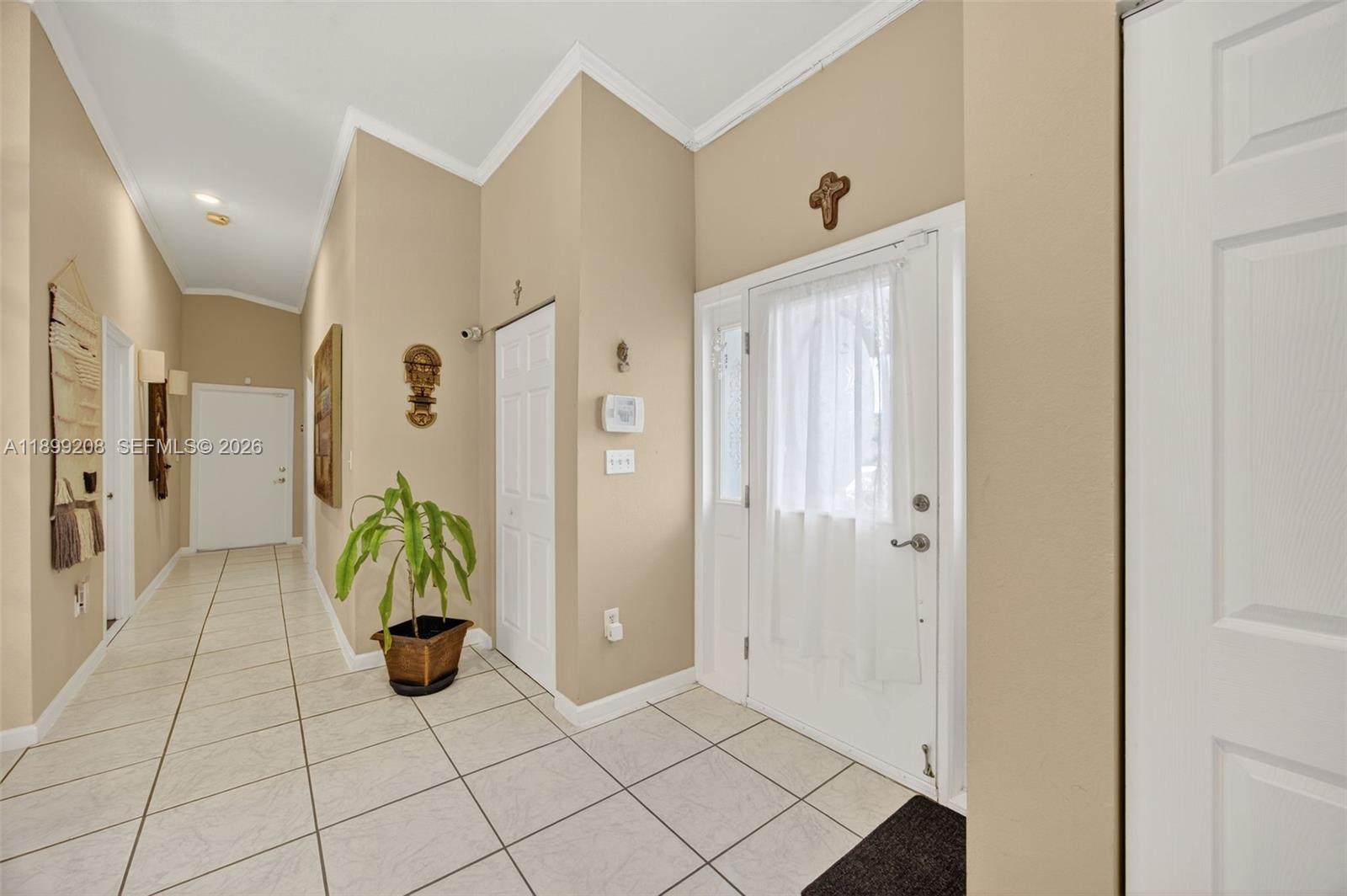 28241 Southwest 157th Court Homestead, FL 33033 - Photo 8 of 52 a view of an entryway with wooden floor