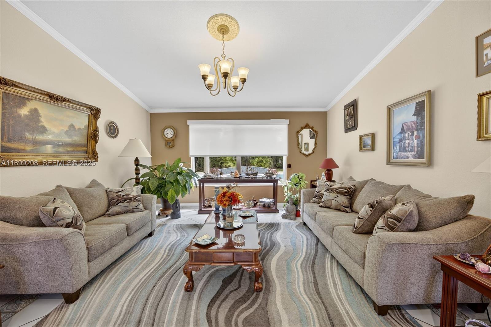 28241 Southwest 157th Court Homestead, FL 33033 - Photo 9 of 52 a living room with furniture kitchen view and a window