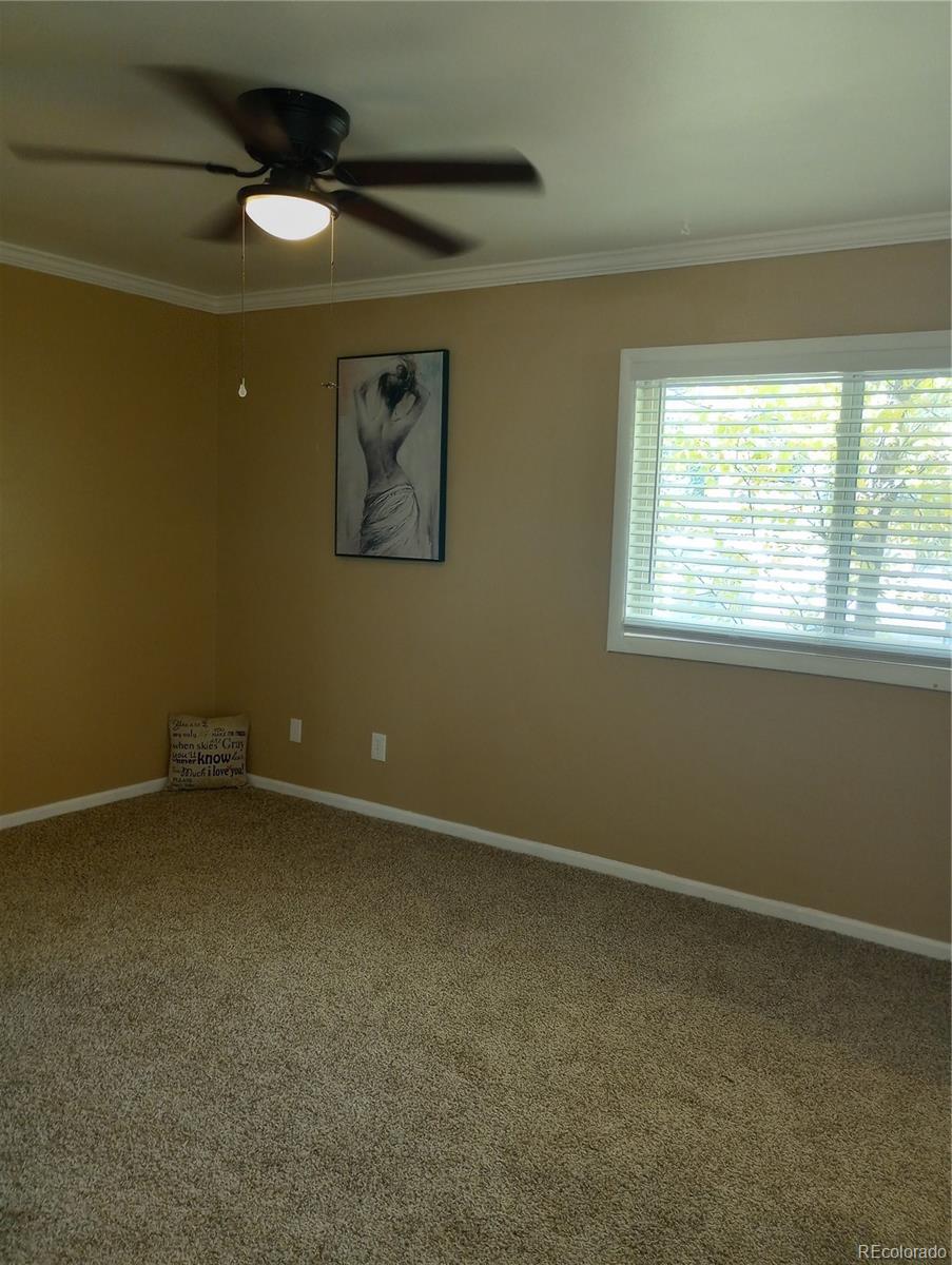 111 Crystal Park Road, Unit 2 Manitou Springs, CO 80829 - Photo 12 of 22 an empty room with a window