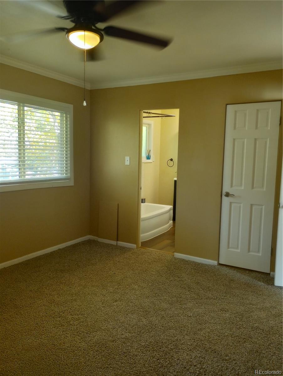 111 Crystal Park Road, Unit 2 Manitou Springs, CO 80829 - Photo 14 of 22 an empty room with windows and cabinet