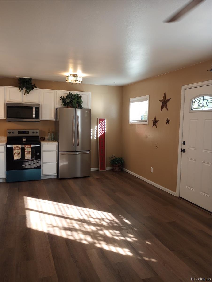 111 Crystal Park Road, Unit 2 Manitou Springs, CO 80829 - Photo 6 of 22 a kitchen with stainless steel appliances a refrigerator and a stove top oven