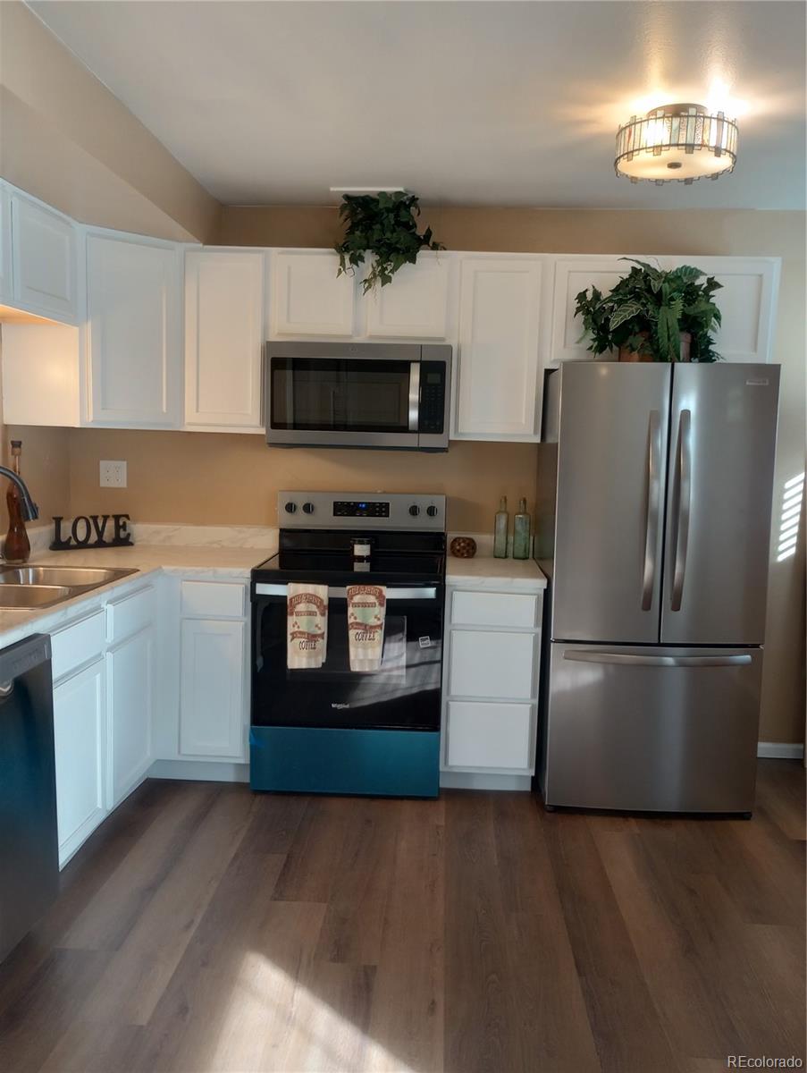 111 Crystal Park Road, Unit 2 Manitou Springs, CO 80829 - Photo 7 of 22 a kitchen with a refrigerator stove and microwave