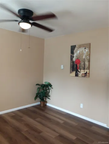 a view of a livingroom with wooden floor