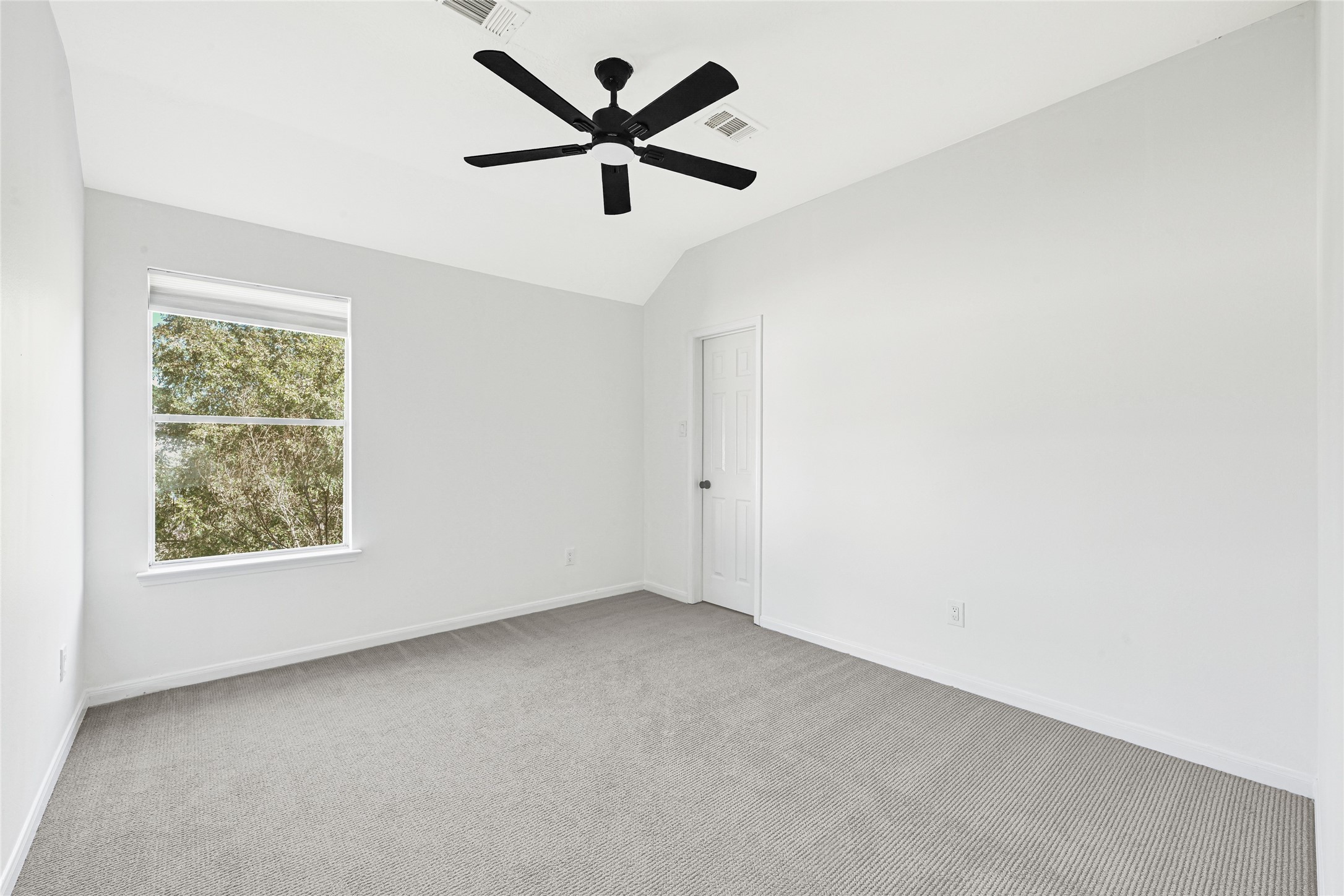 16502 Barker Ranch Court Cypress, TX 77429 - Photo 12 of 21 an empty room with a window and a fan