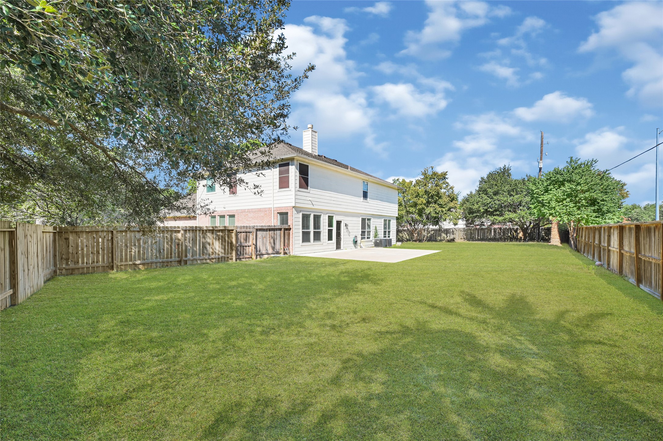16502 Barker Ranch Court Cypress, TX 77429 - Photo 21 of 21 a view of a house next to a yard with plants and trees