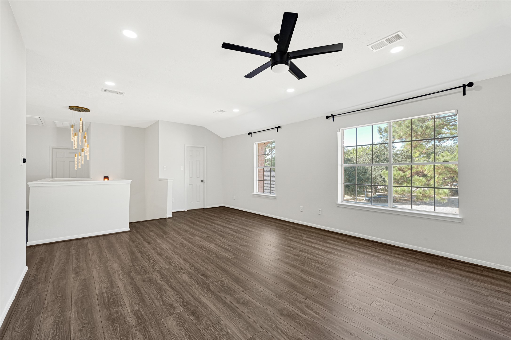 16502 Barker Ranch Court Cypress, TX 77429 - Photo 10 of 21 a view of empty room with wooden floor and window