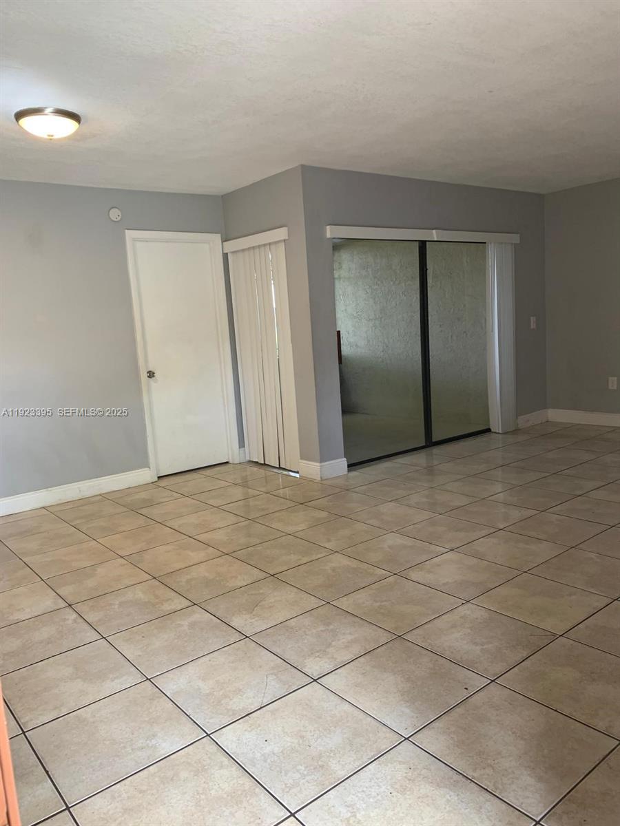 20320 Northeast 3rd Court, Unit 7 Miami, FL 33179 - Photo 2 of 10 a view of an empty room