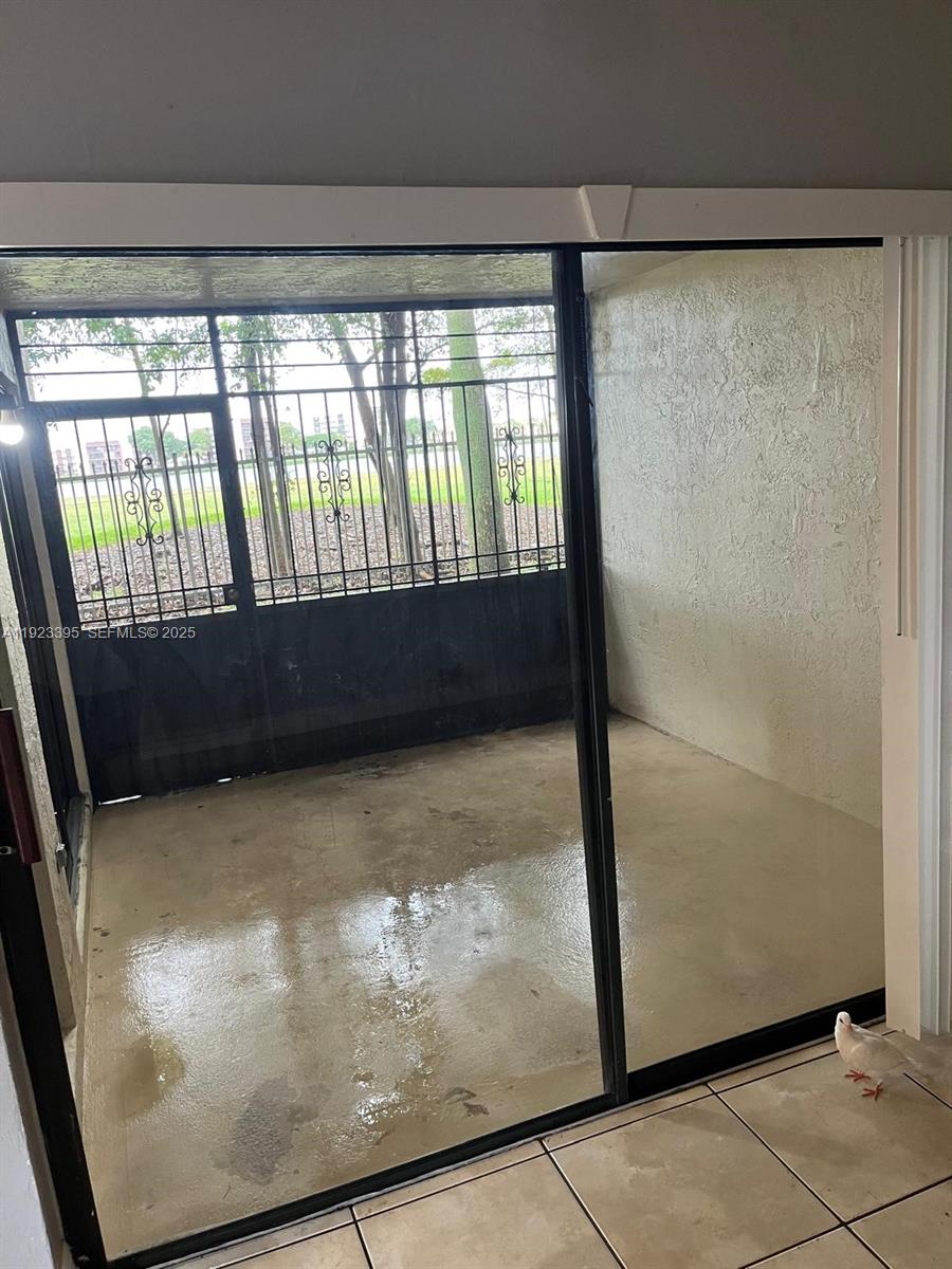 20320 Northeast 3rd Court, Unit 7 Miami, FL 33179 - Photo 3 of 10 a view of entry way