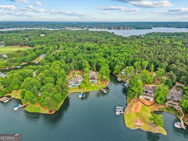 a view of a dining room with furniture wooden floor and chandelier