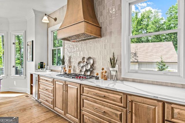 a spacious bedroom with a bed and large windows