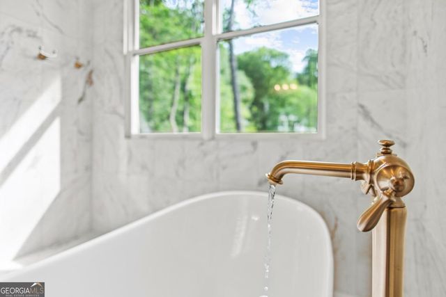 a view of a floor to ceiling window with a view of roof