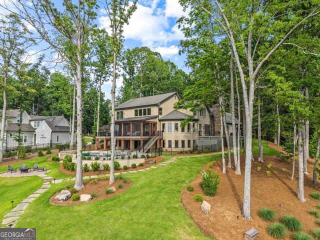 a view of yard with seating area and trees around