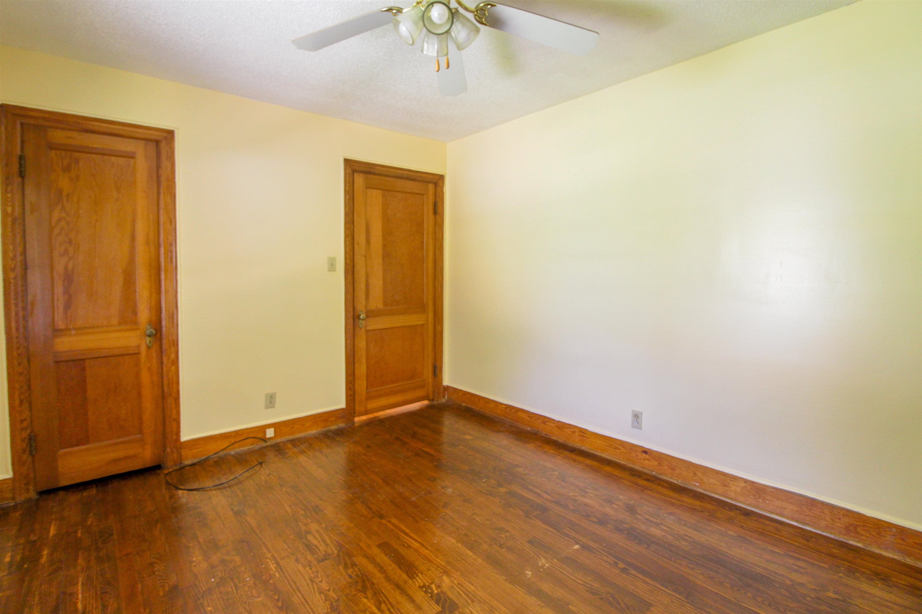 274 Joann Street Ripley, TN 38063 - Photo 15 of 28 an empty room with wooden floor closet and windows