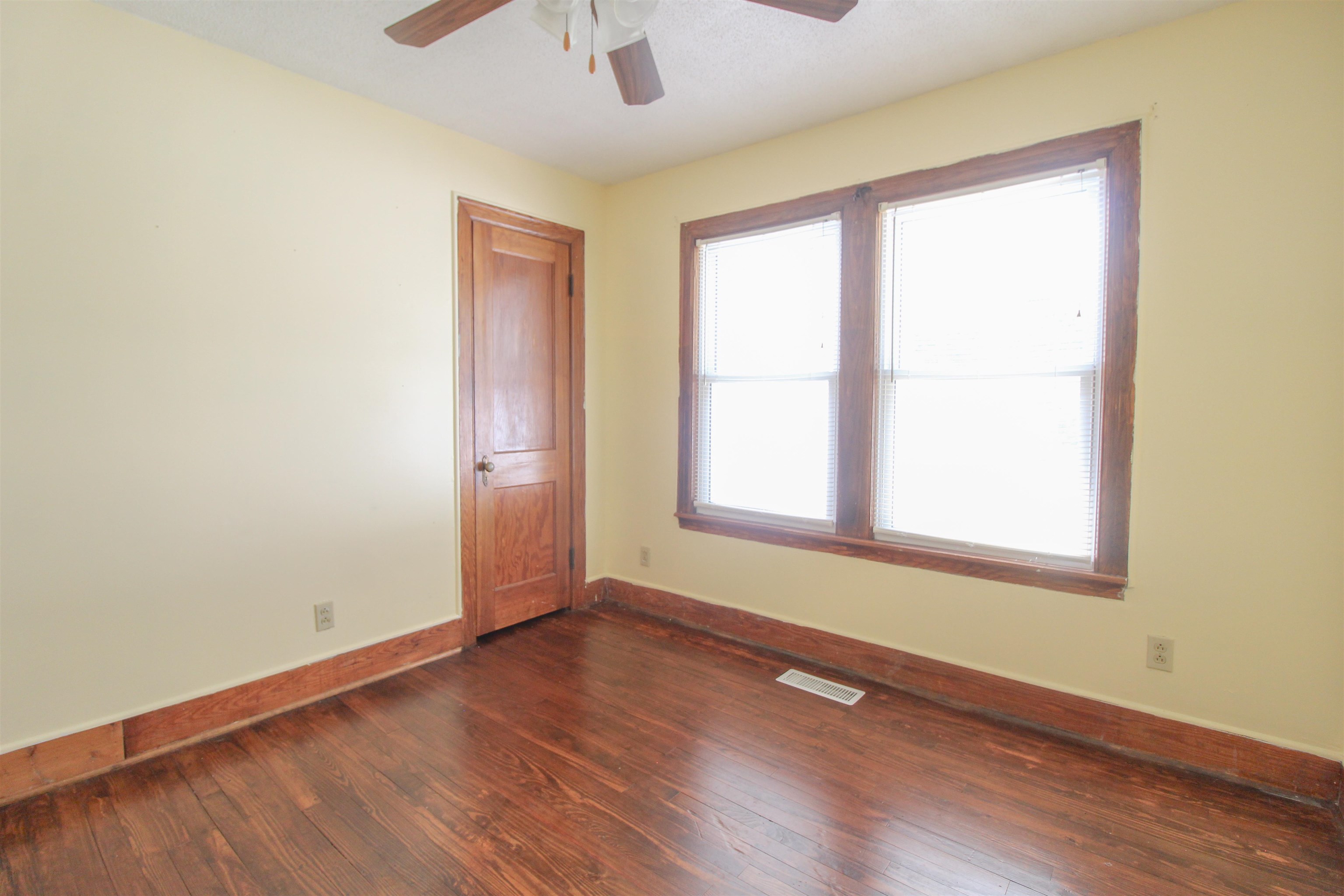 274 Joann Street Ripley, TN 38063 - Photo 17 of 28 an empty room with wooden floor and windows