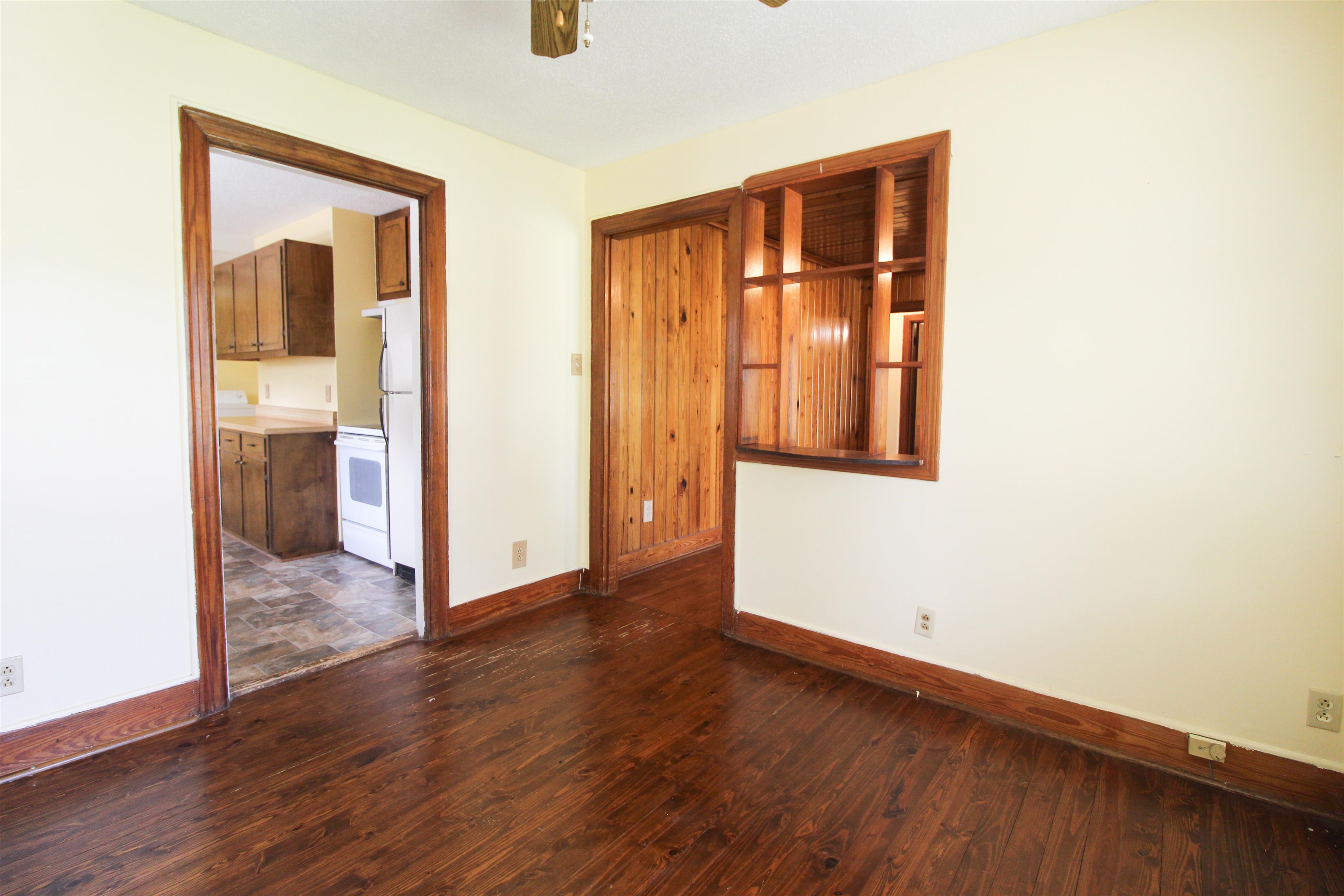 274 Joann Street Ripley, TN 38063 - Photo 7 of 28 an empty room with wooden floor and windows