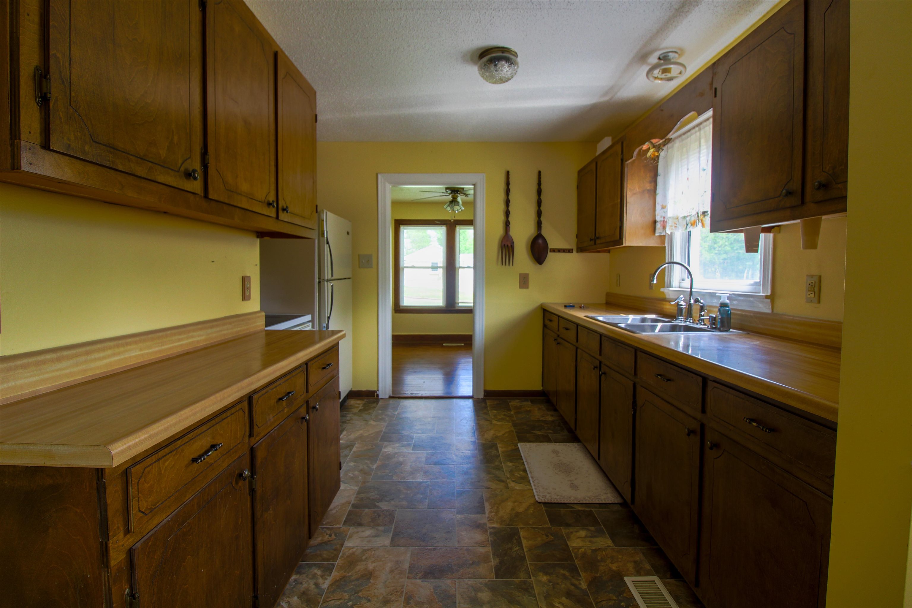 274 Joann Street Ripley, TN 38063 - Photo 10 of 28 a kitchen with stainless steel appliances a sink stove and cabinets