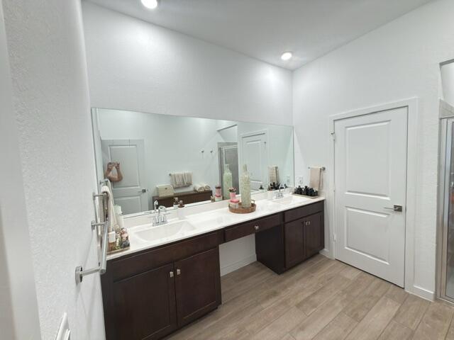 19696 Weathervane Way Loxahatchee, FL 33470 - Photo 15 of 39 a view of a kitchen with a sink and dishwasher with wooden floor