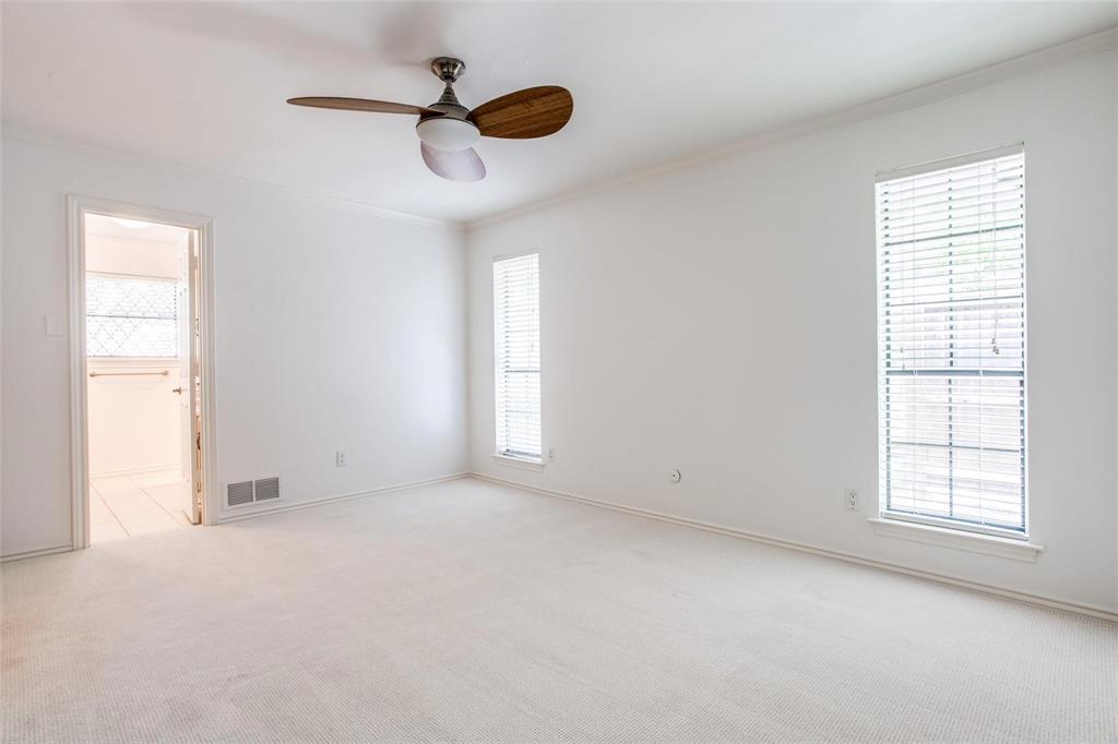 6926 Northwood Road Dallas, TX 75225 - Photo 26 of 29 an empty room with windows