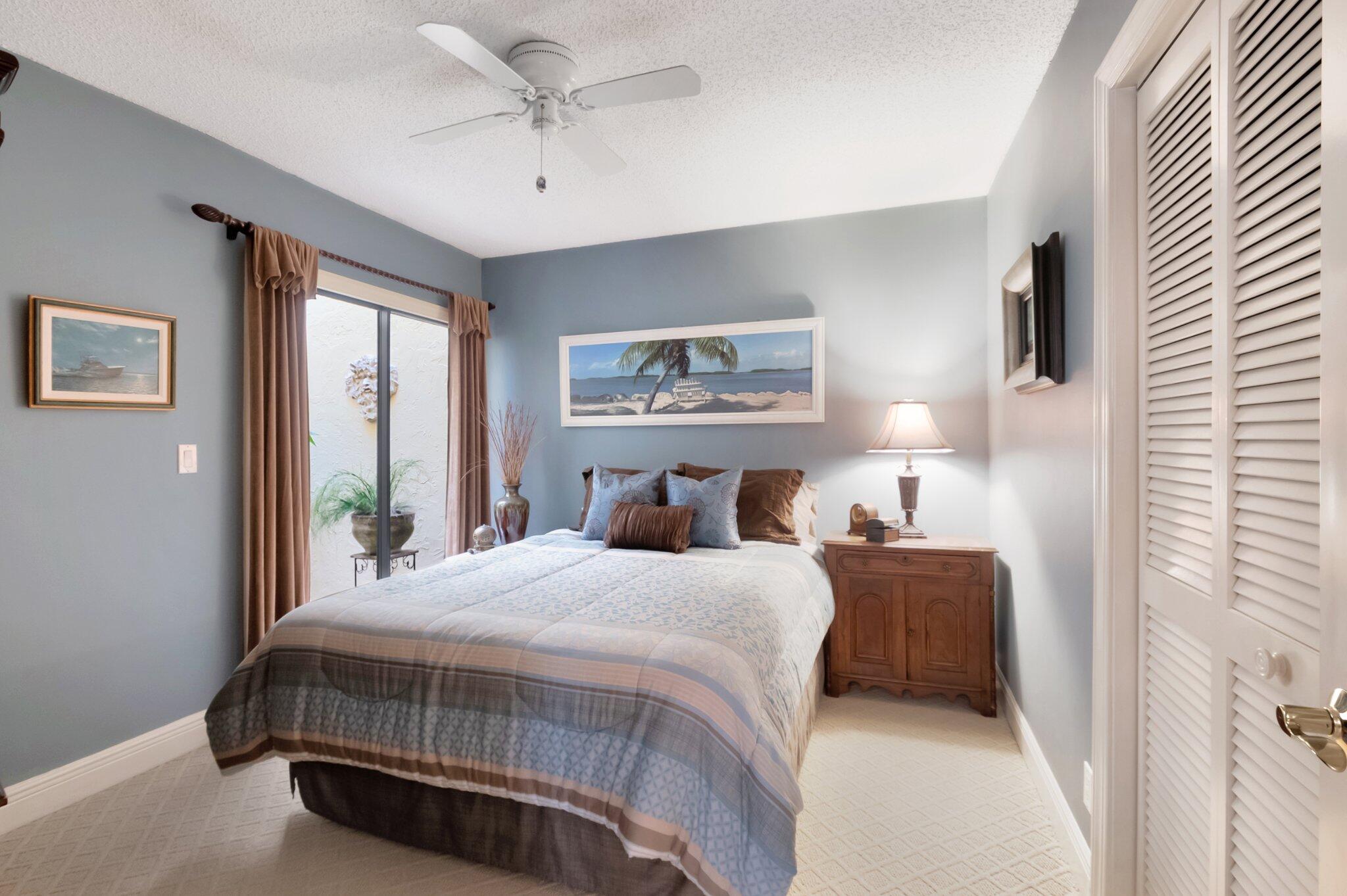 9758 Erica Court Boca Raton, FL 33496 - Photo 29 of 74 2nd Bedroom with sliders onto atrium