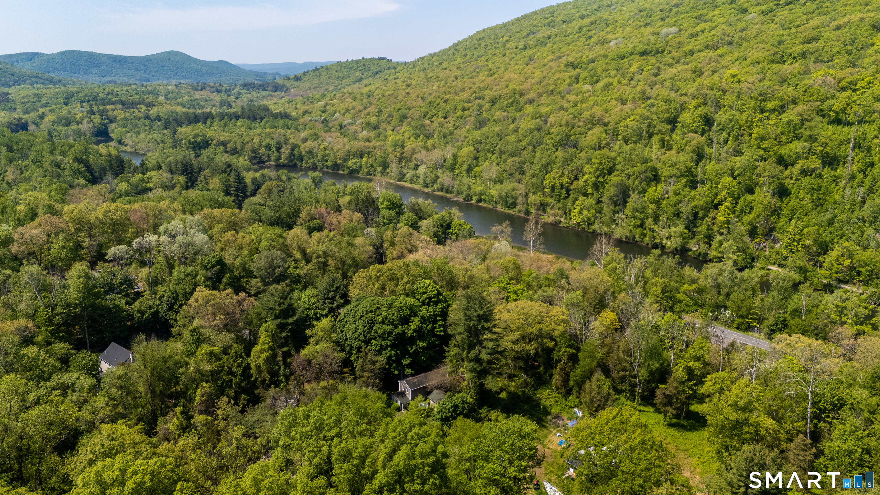 231 B Kent Road Kent, CT 06757 - Photo 29 of 35 a view of a forest with a mountain