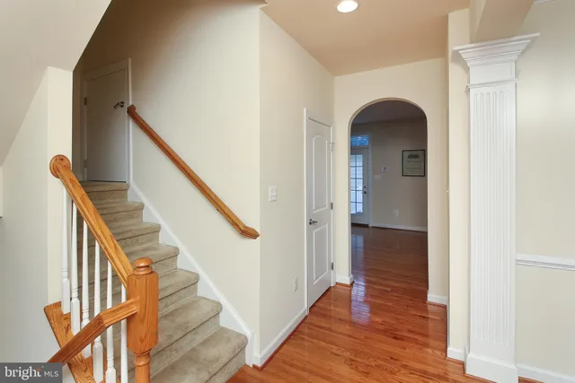 a view of entryway with wooden floor and stairs