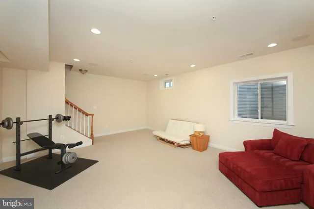 a view of a house with yard and sitting area