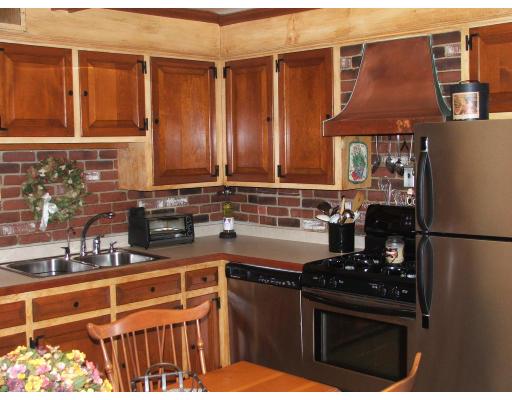 63 Cedarhill Road Holbrook, MA 02343 - Photo 11 of 18 a kitchen with stainless steel appliances granite countertop a refrigerator stove and sink