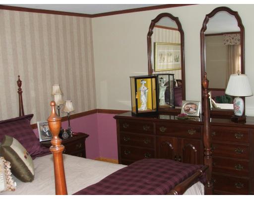 63 Cedarhill Road Holbrook, MA 02343 - Photo 14 of 18 a bedroom with a bed and a dresser