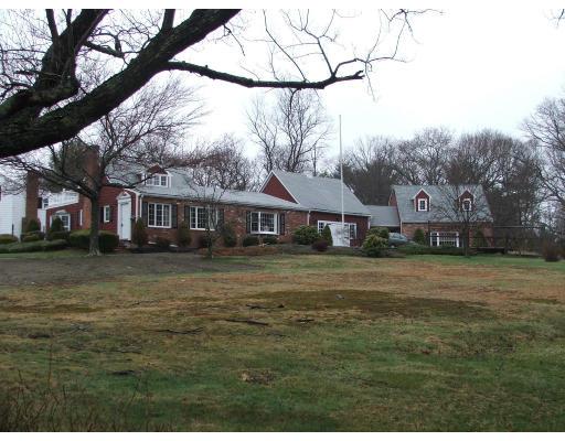 63 Cedarhill Road Holbrook, MA 02343 - Photo 15 of 18 a front view of a house with a garden