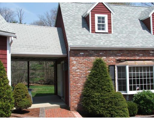63 Cedarhill Road Holbrook, MA 02343 - Photo 16 of 18 a view of a house with a yard and potted plants