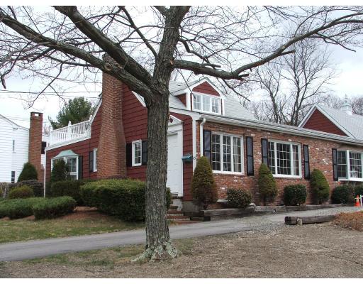 63 Cedarhill Road Holbrook, MA 02343 - Photo 2 of 18 a front view of a house with garden