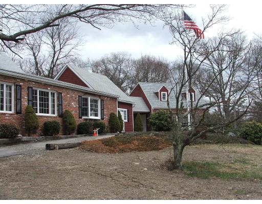 63 Cedarhill Road Holbrook, MA 02343 - Photo 4 of 18 a front view of a house with a yard