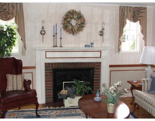 63 Cedarhill Road Holbrook, MA 02343 - Photo 5 of 18 a living room with furniture and a fireplace