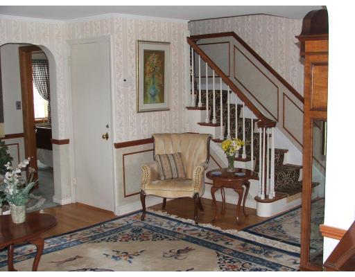 63 Cedarhill Road Holbrook, MA 02343 - Photo 9 of 18 a view of staircase with wooden floor and a rug