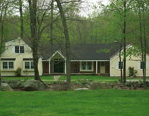 221 Linden Tree Road Wilton, CT 06897 - Photo 1 of 1 a front view of a house with a yard