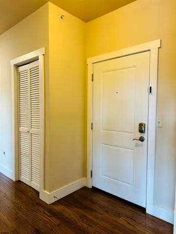a view of a small space with wooden floor