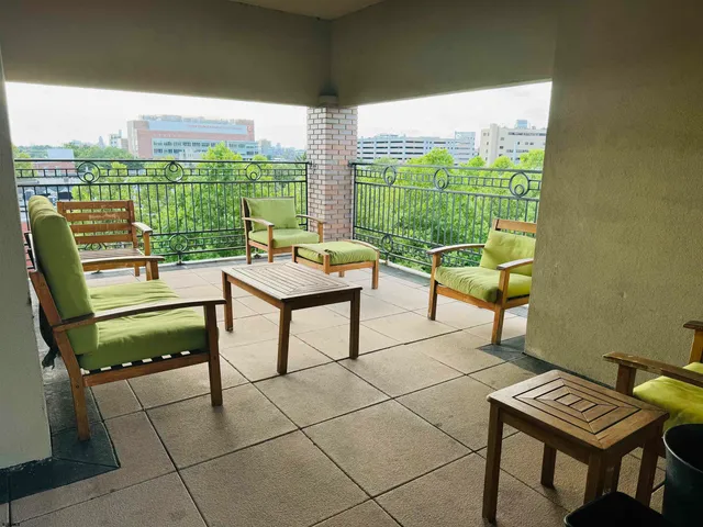 a view of a terrace with furniture and garden
