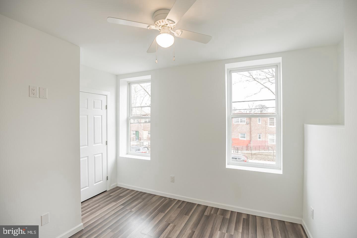 2630 Ridge Avenue, Unit 1 Philadelphia, PA 19121 - Photo 11 of 13 a view of an empty room with a window and wooden floor