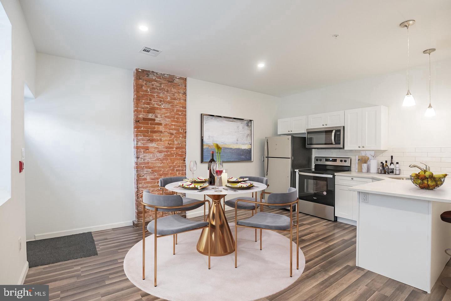 2630 Ridge Avenue, Unit 1 Philadelphia, PA 19121 - Photo 4 of 13 a living room with stainless steel appliances furniture a dining table and kitchen view