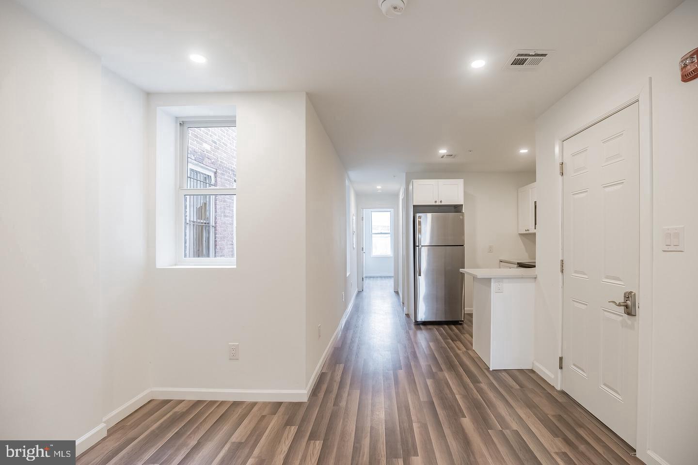 2630 Ridge Avenue, Unit 1 Philadelphia, PA 19121 - Photo 6 of 13 a view of a kitchen from a hallway