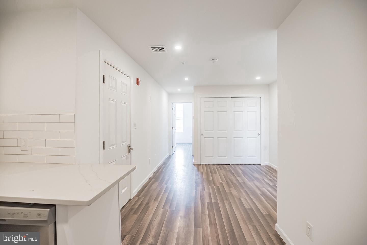 2630 Ridge Avenue, Unit 1 Philadelphia, PA 19121 - Photo 7 of 13 a view of a hallway with wooden floor