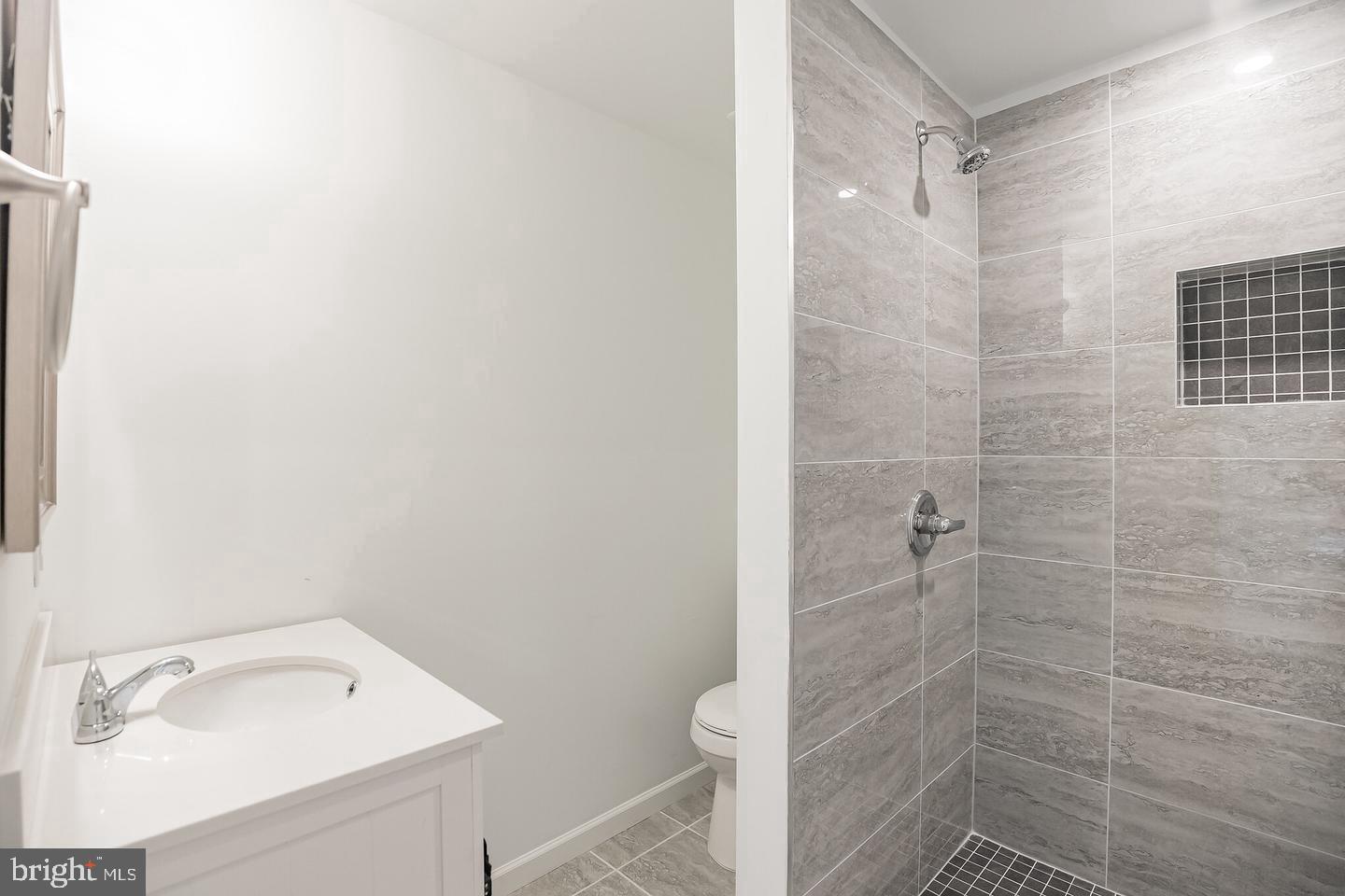 2630 Ridge Avenue, Unit 1 Philadelphia, PA 19121 - Photo 9 of 13 a bathroom with a shower a sink and vanity