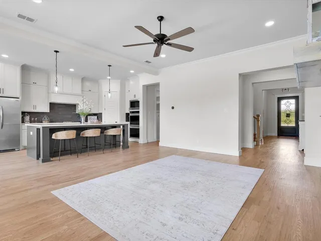 a view of kitchen with cabinets and wooden floor