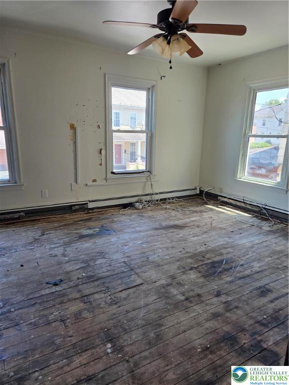 210 2nd Street Slatington, PA 18080 - Photo 18 of 28 an empty room with windows and fan