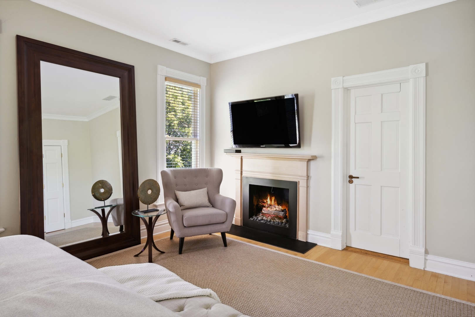 417 East Deerpath Road Lake Forest, IL 60045 - Photo 20 of 43 a living room with furniture a fireplace and a flat screen tv