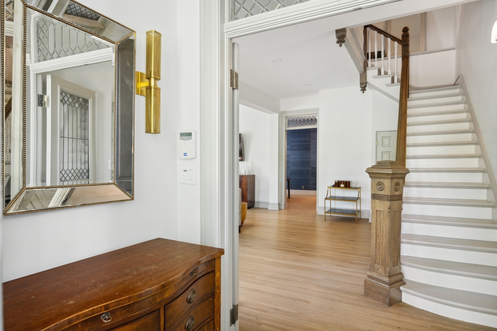 417 East Deerpath Road Lake Forest, IL 60045 - Photo 3 of 43 a view of a hallway with wooden floor and staircase