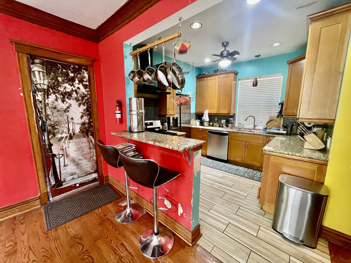 7916 South Constance Avenue Chicago, IL 60617 - Photo 11 of 28 a kitchen with stainless steel appliances granite countertop a stove a sink and a refrigerator