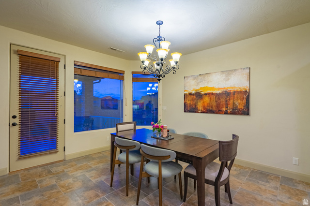 2212 Chippenham Court St. George, UT 84770 - Photo 15 of 75 Dining room with stone finish flooring and suspended lighting